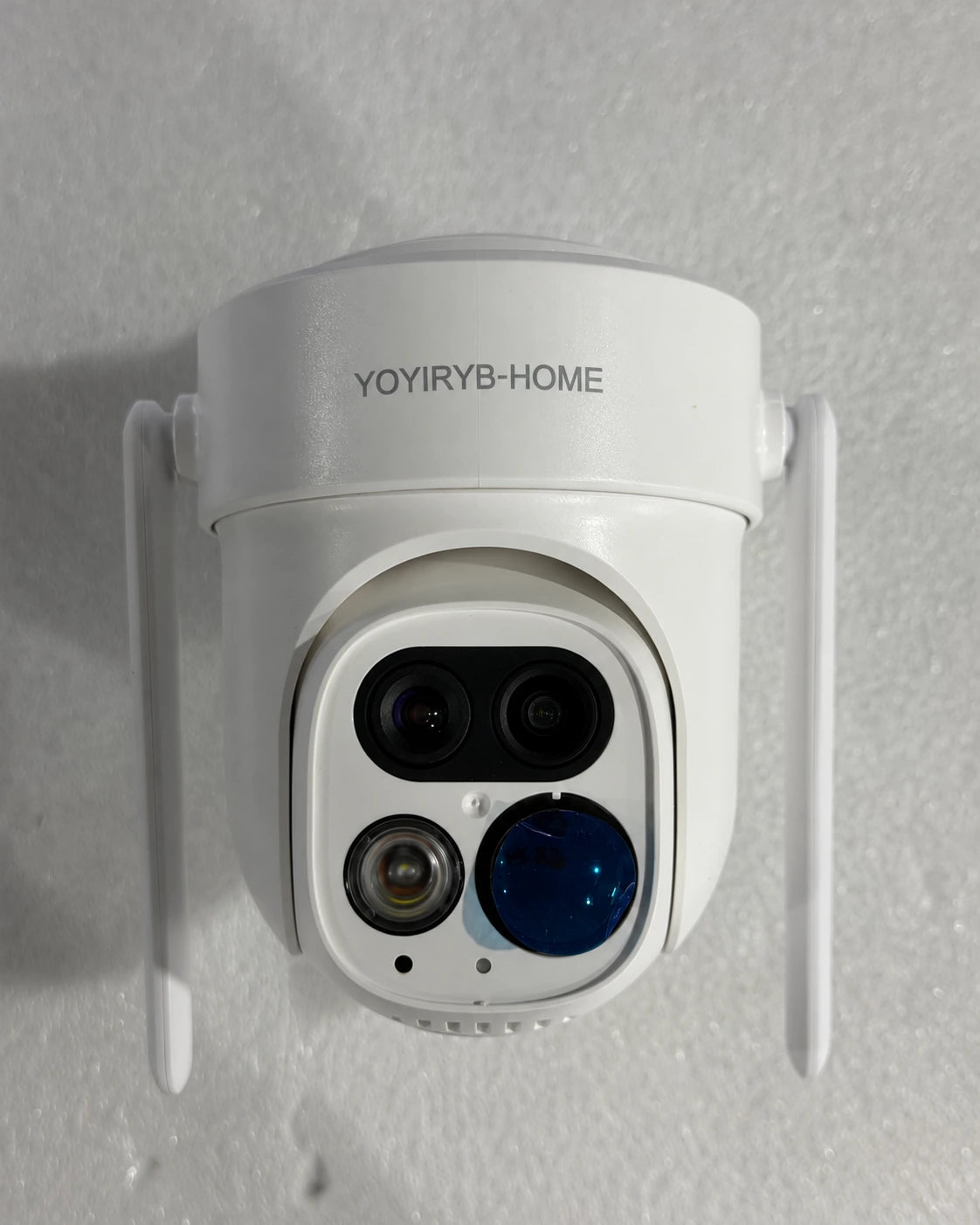 Real front-view photograph of white YOYIRYB-HOME dual-antenna outdoor security camera